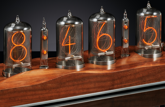 Walnut nixie clock with a carved walnut base.