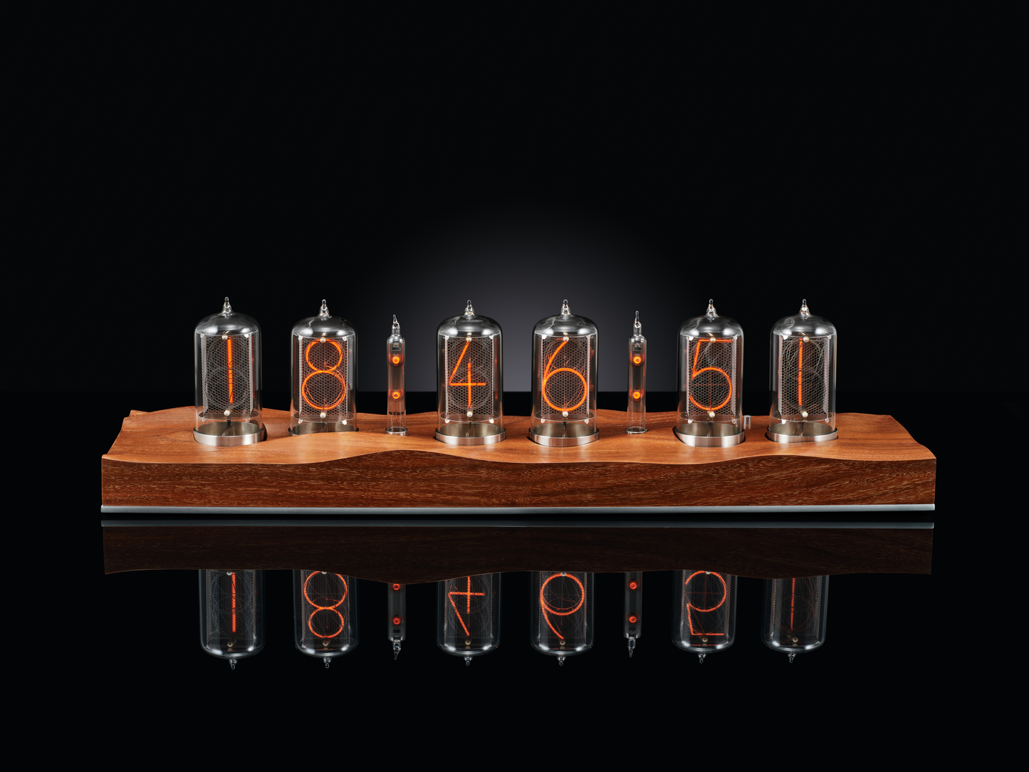 Nixie clock made with 6 tubes and a carved walnut base.